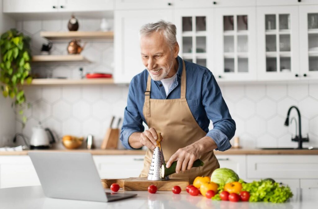 Someone follows a recipe on their laptop in an effort to eat healthier.